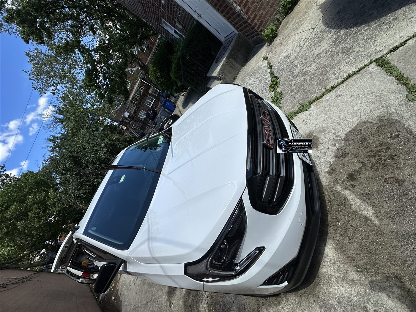 GMC Terrain exterior after mobile detailing — glossy white paint and deep black trim