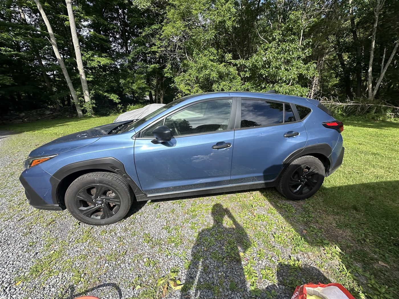 Subaru Crosstrek exterior before mobile detailing — road film on paint and dusty wheels
