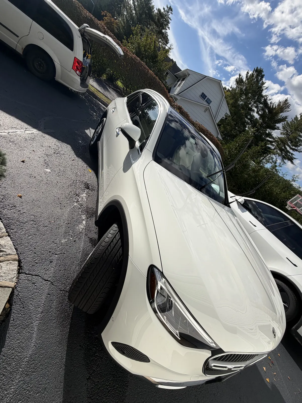 White Mercedes-Benz front three-quarter view in a driveway