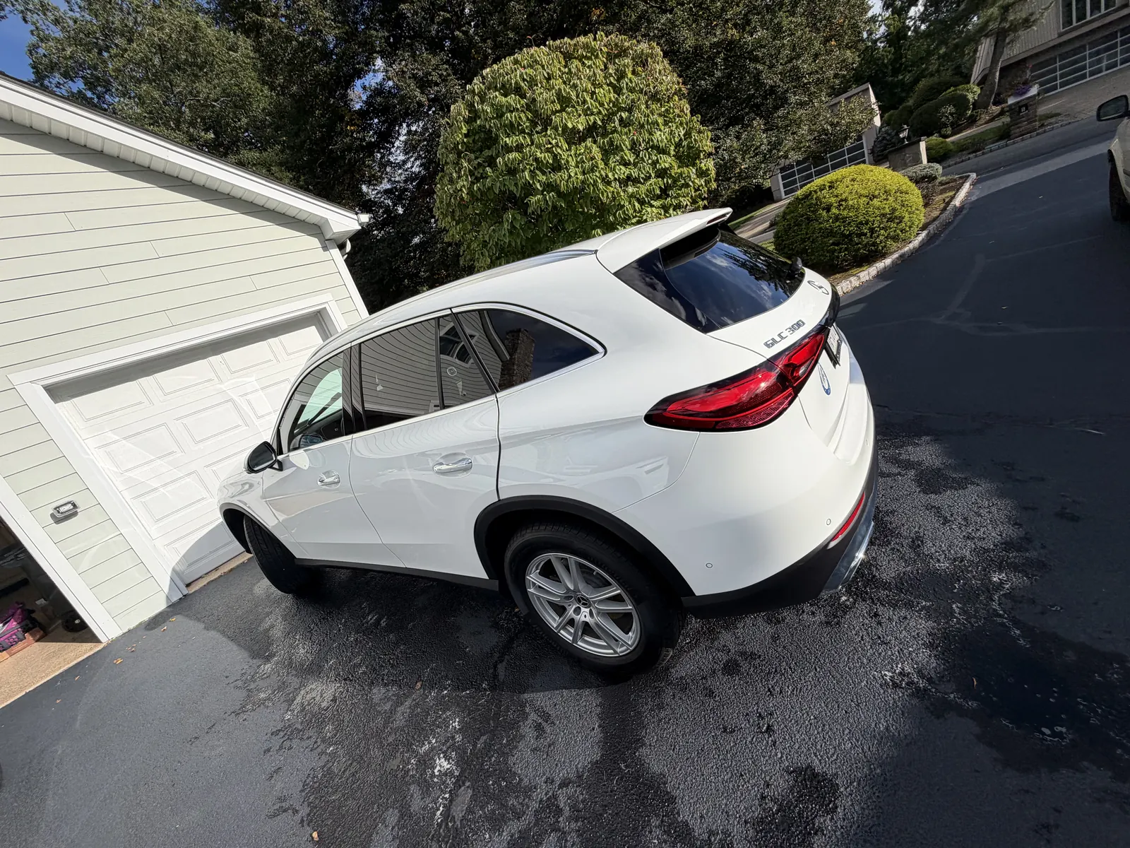 White Mercedes-Benz GLC rear view in a driveway