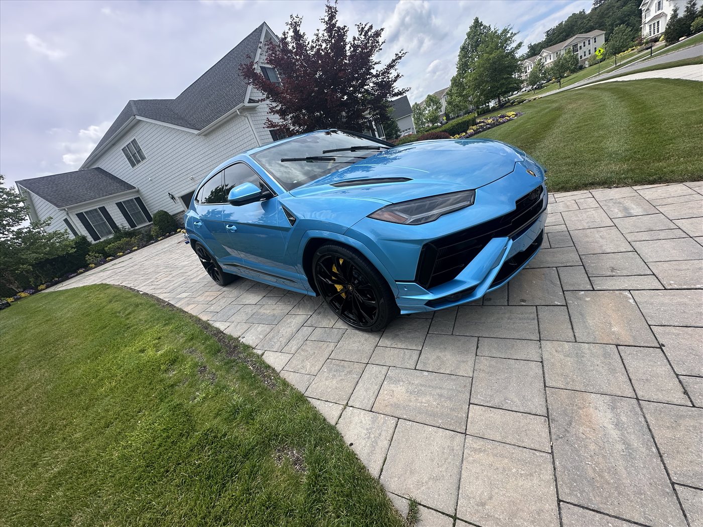 Lamborghini Urus after exterior detail — deep gloss on grey paint and clean wheels